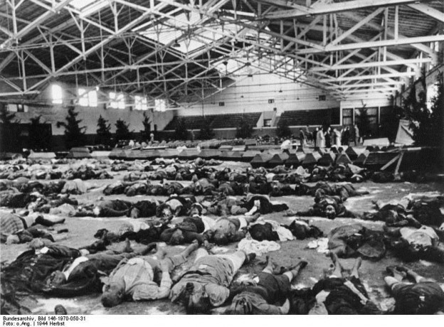 Dead laid out for identification after air attack. Bundesarchiv, Bild 146-1970-050-31/CC-BY-SA